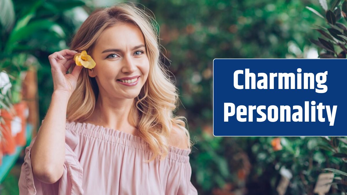 Smiling portrait of blonde young woman holding yellow flower in her ear's.