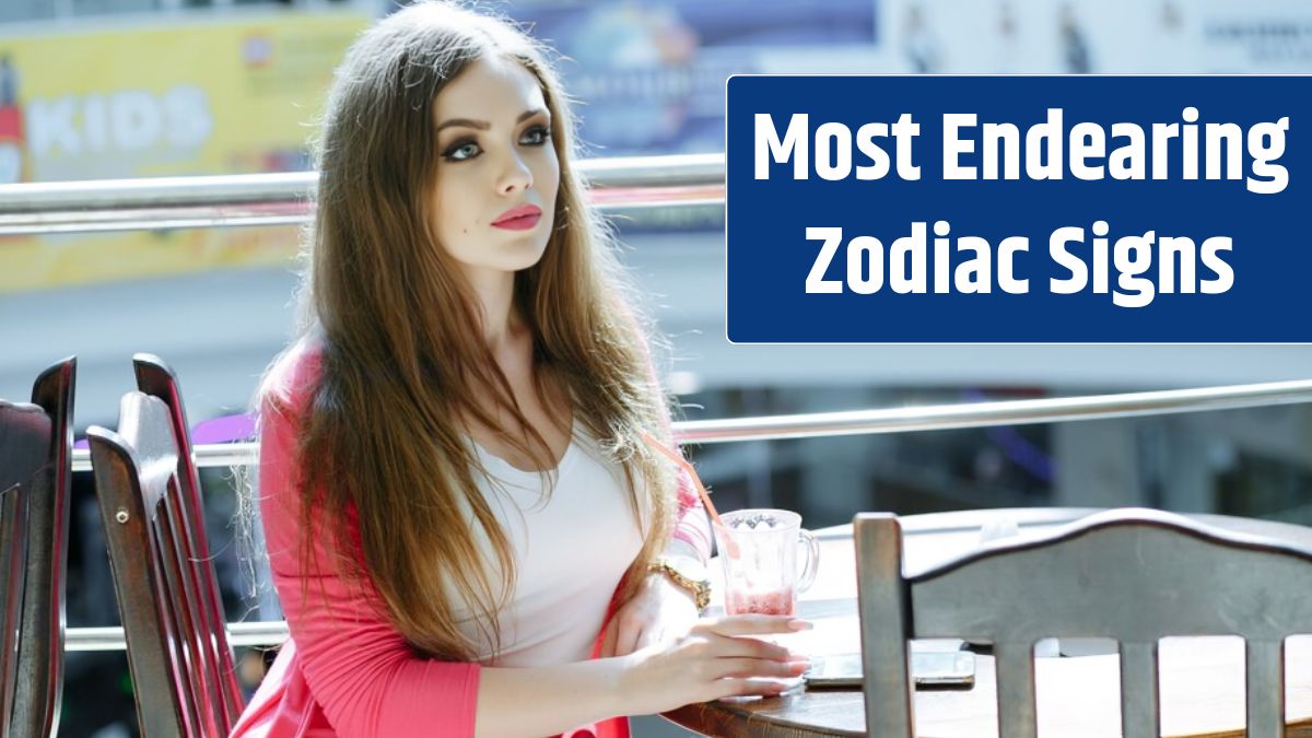 Young girl with serious face sitting at a restaurant table.